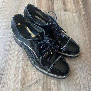 The office of Angela Scott patent leather heeled oxfords size 36